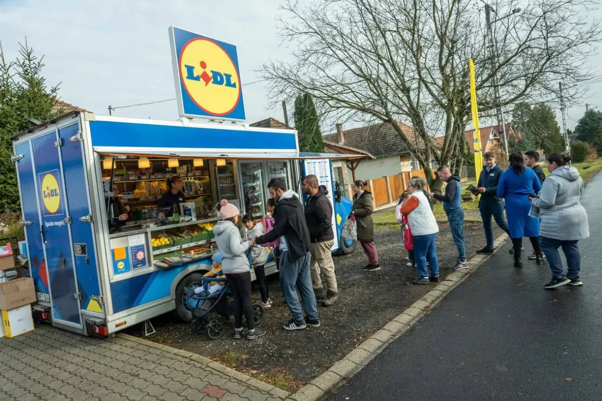 People queueing at a Lidl mobile shop van in a residential area